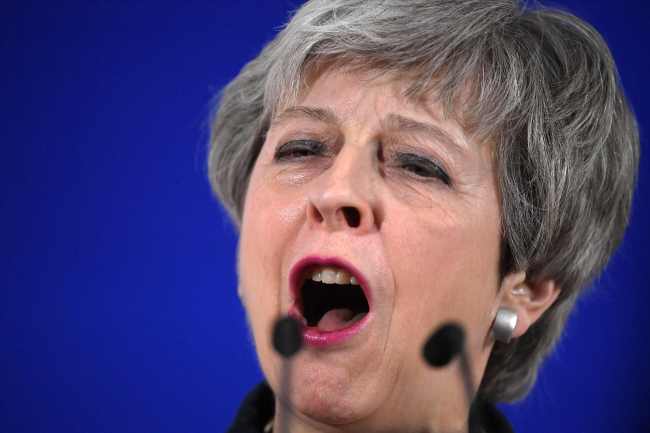 British Prime Minister Theresa May holds a press conference on March 22 at the end of the first day of an EU summit focused on Brexit, in Brussels. (AFP)