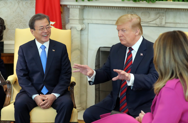 President Moon Jae-in and US President Donald Trump speak at the White House on Thursday. Yonhap