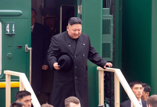 North Korean leader Kim Jong-un disembarks from his train in Russian border city of Khasan on Wednesday. Yonhap