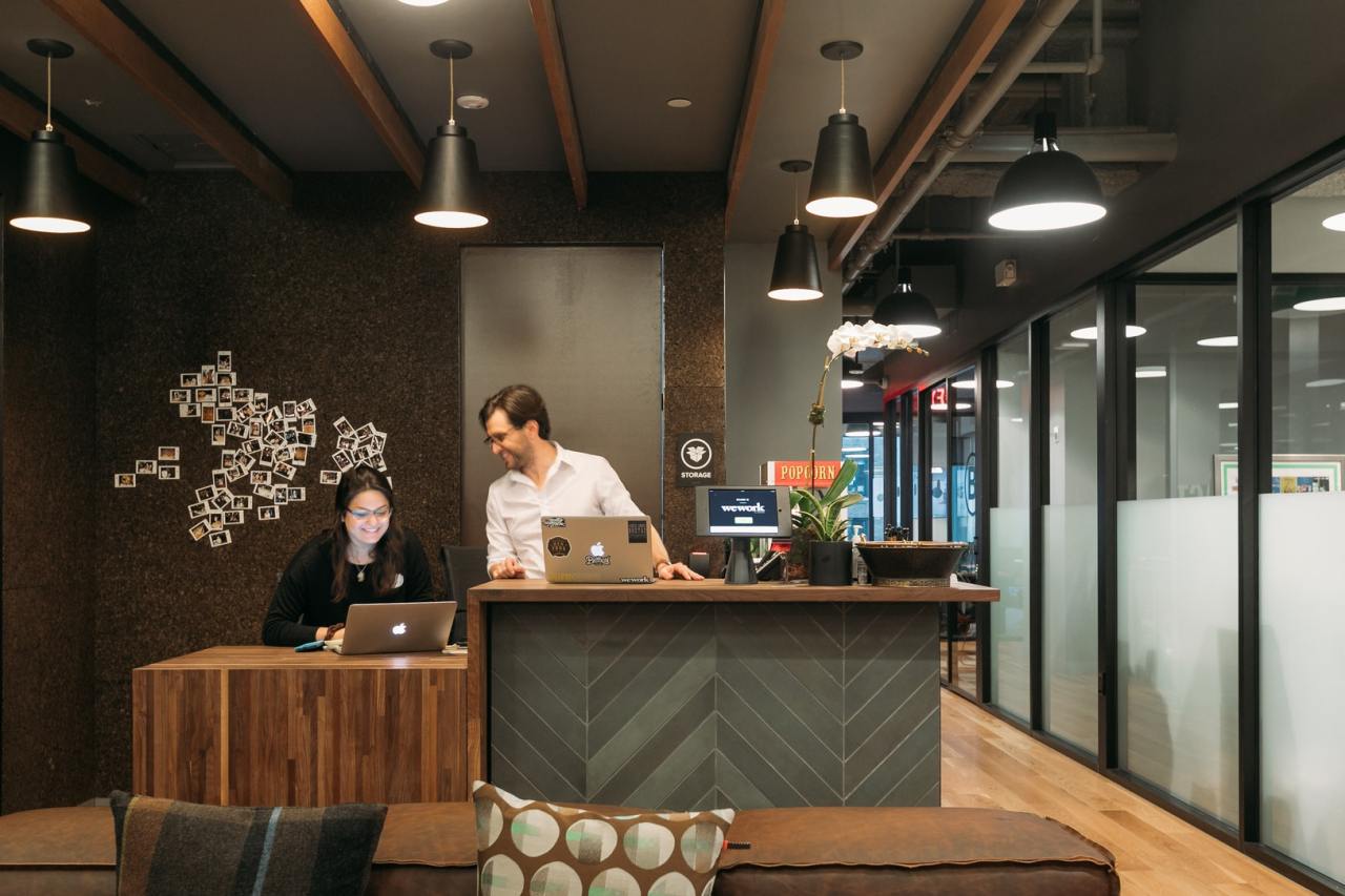 Staff members of coworking space firm WeWork work at the company's headoffice in New York City. (WeWork)