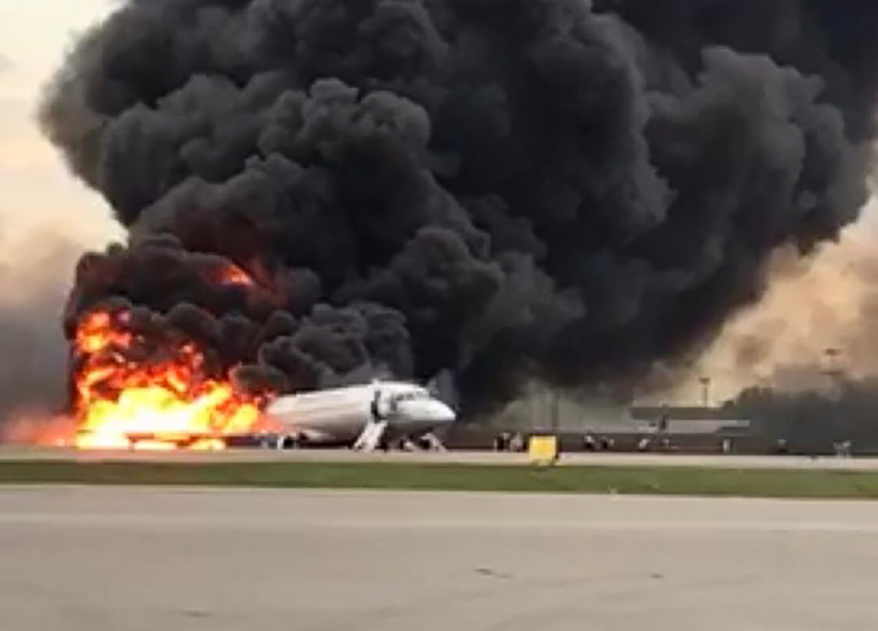 This handout picture taken and realeased on May 5, 2019, by the Investigative Committee of Russia shows a fire of a Russian-made Superjet-100 at Sheremetyevo airport outside Moscow. - The Interfax agency reported that the plane, a Russian-made Superjet-100, had just taken off from Sheremetyevo airport on a domestic route when the crew issued a distress signal. (AFP-Yonhap)