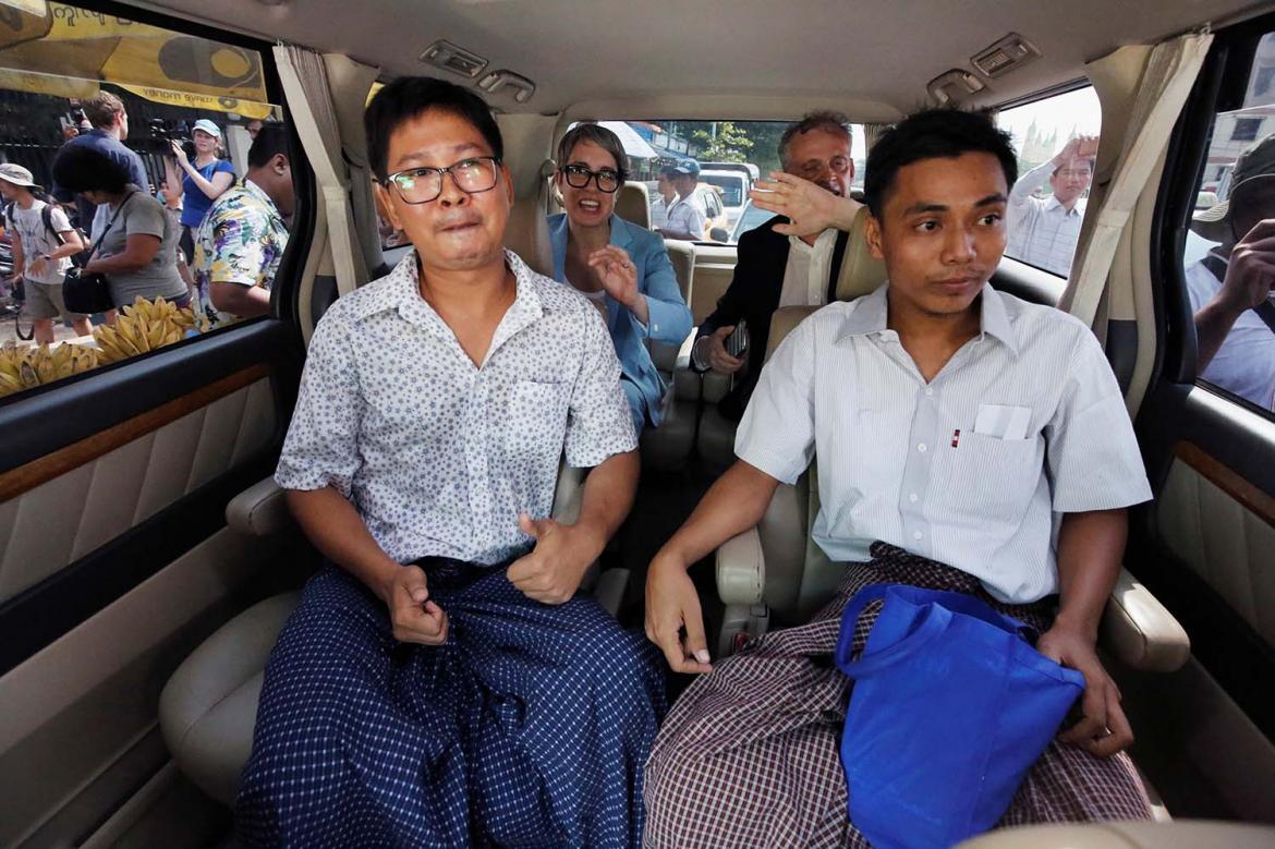 Reuters journalists Kyaw Soe Oo (right) and Wa Lone sit in a vehicle after being released from Insein Prison in a presidential pardon on May 7 (AFP)