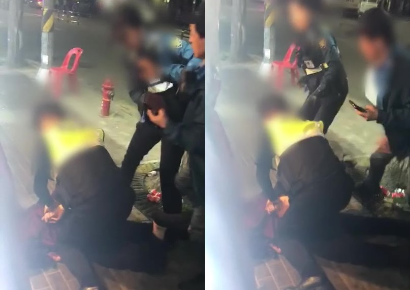 A screen grab of the video shot by a citizen and released by police, which shows a female officer getting pushed by a drunk man on a street in Daerim-dong, Seoul, on May 19.
(Guro Police Station)　