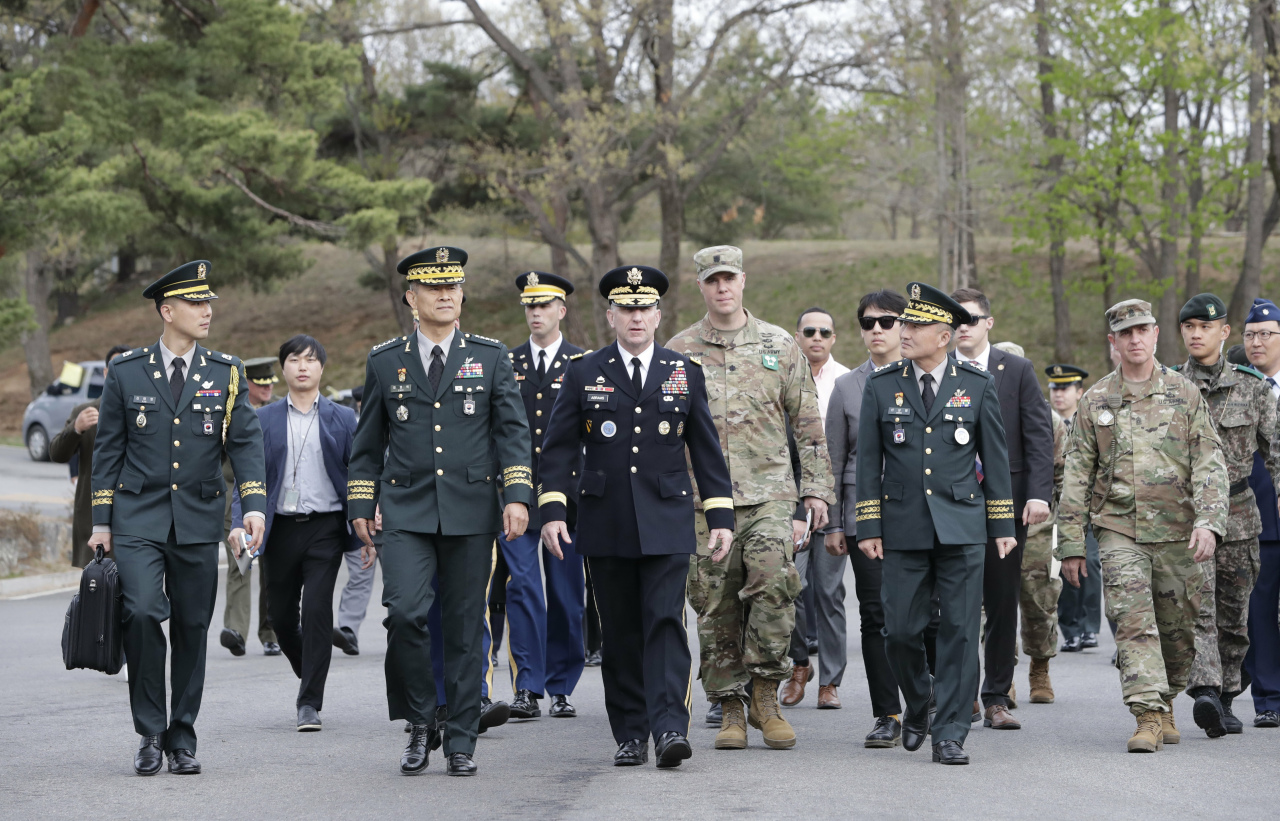 U.S. Gen. Robert Abrams, center, commander of the United Nations Command, Combined Forces Command, and United States Forces Korea, arrives for a ceremony to mark the first anniversary of Panmunjom declaration between South Korean President Moon Jae-in and North Korean leader Kim Jong Un held in April 27, 2018 at the southern side of Panmunjom in the Demilitarized Zone, South Korea, Saturday, April 27, 2019. (AP-Yonhap)