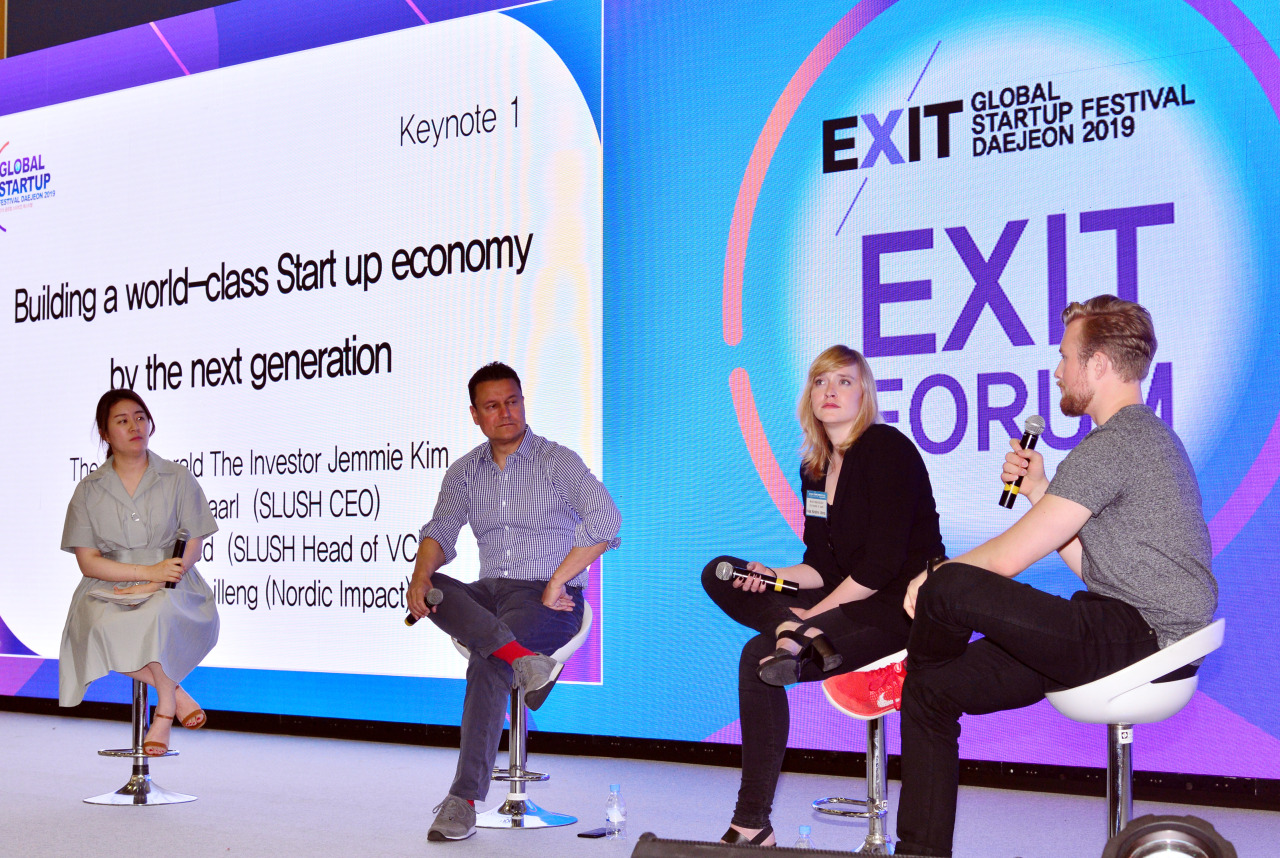 The Investor Editor-in-Chief Kim Ji-hyun (from left) and panelists -- Slush Head of VC Moaffak Ahmed, Nordic Impact Co-founder Kaja Kirstine Lilleng and Slush CEO Andreas Saari -- discuss ways to build the startup economy during a panel session of EXIT Forum on Tuesday. (Park Hyun-koo / The Korea Herald)