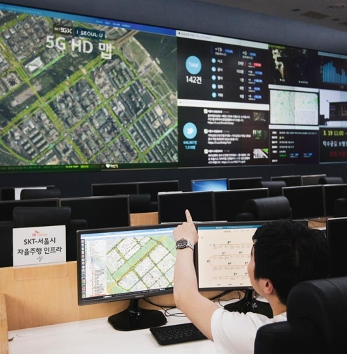 A Seoul city government official watches traffic control system. SKT