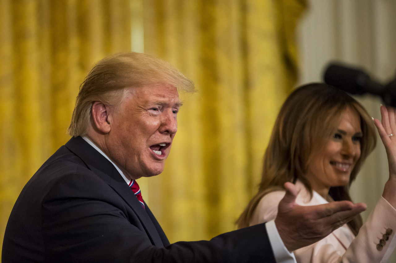 US President Donald Trump and US First Lady Melania Trump wave during a Polish-American reception at the White House in Washington, DC on June 12, 2019. (UPI-Yonhap)
