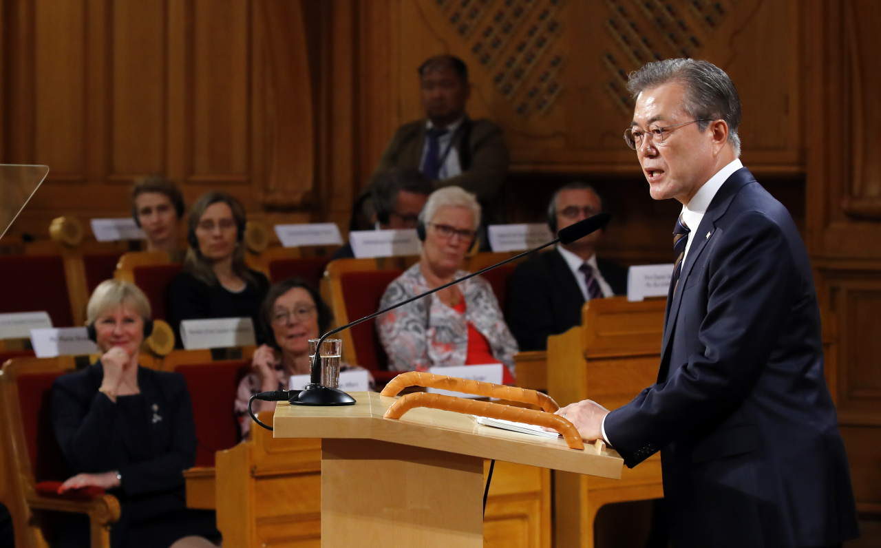 President Moon Jae-in addresses the Swedish parliament on Friday. Yonhap