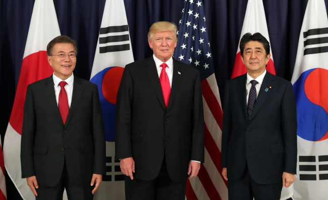 South Korean President Moon Jae-in, US President Donald Trump, and Japanese President Shinzo Abe. (Yonhap)