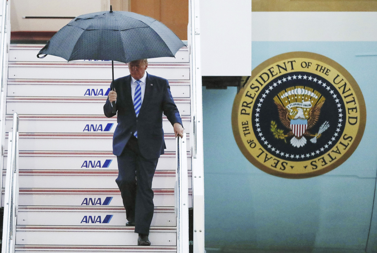 U.S. President Donald Trump arrives at the Osaka International Airport to attend the G-20 Summit in Osaka, western Japan. (AP)
