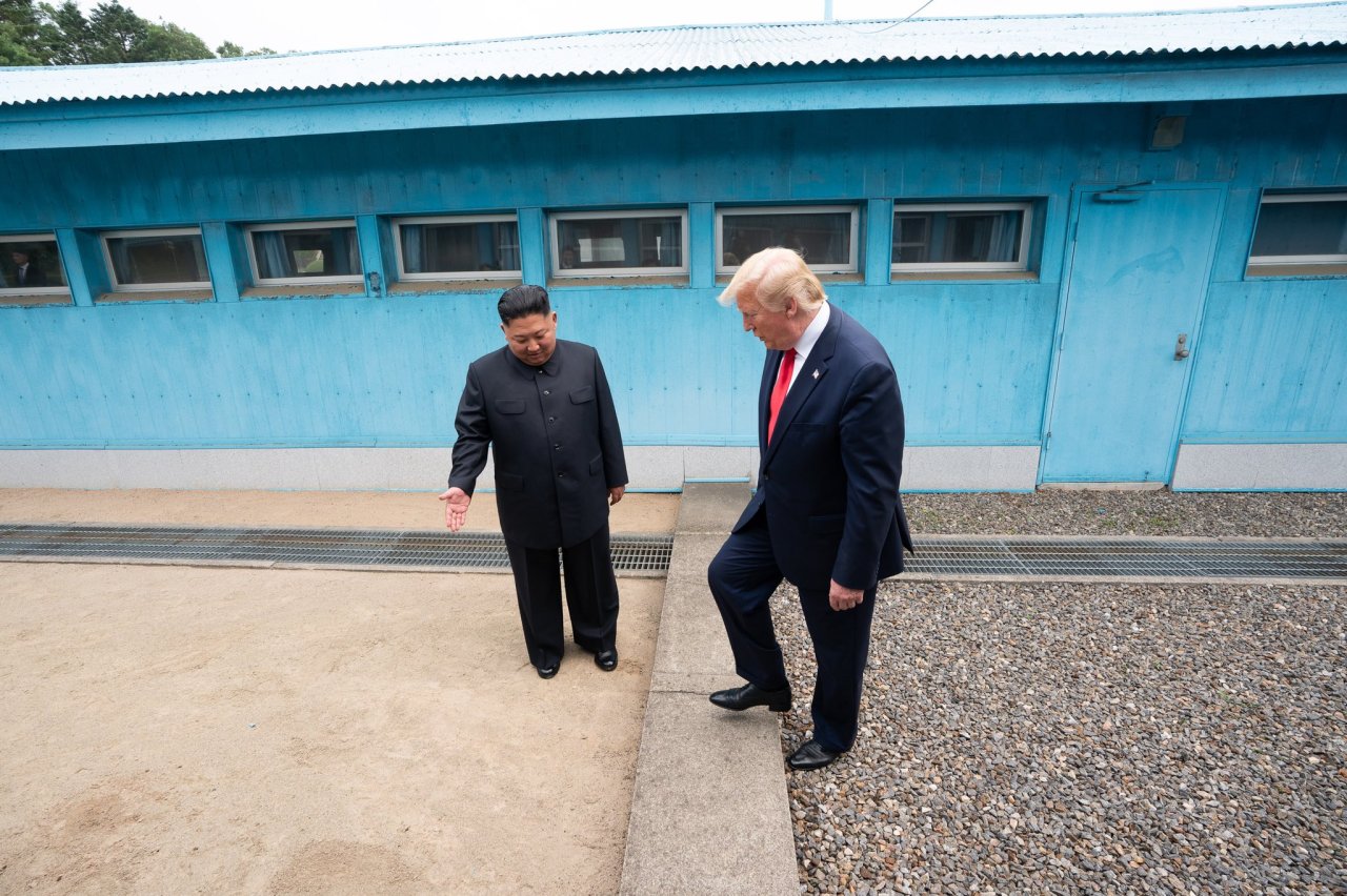 US President Donald Trump steps over the Military Demarcation Line that separates the two Koreas at Panmunjom on Sunday as North Korean leader Kim Jong-un gestures him over.   Donald Trump’s Twitter account