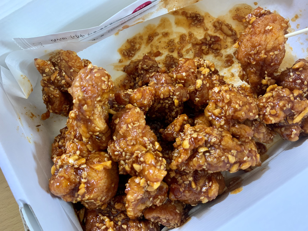 Sokcho market dak-gangjeong sold at Jungang Market street stalls in Gangwon Province Korea showing takeaway paper cups filled with the crispy bite-sized fried chicken pieces