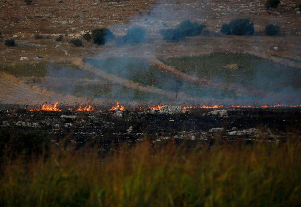 This picture taken on September 1, 2019 from a location near the northern Israeli town of Avivim, close to the border with Lebanon, shows fires and smoke rising after Lebanon's Shiite Muslim Hezbollah movement fired anti-tank missiles into northern Israel. (AFP)