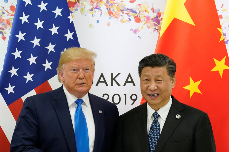 US President Donald Trump and China's President Xi Jinping poses for a photo ahead of their bilateral meeting during the G20 leaders summit in Osaka, Japan, June 29, 2019. (Reuters)