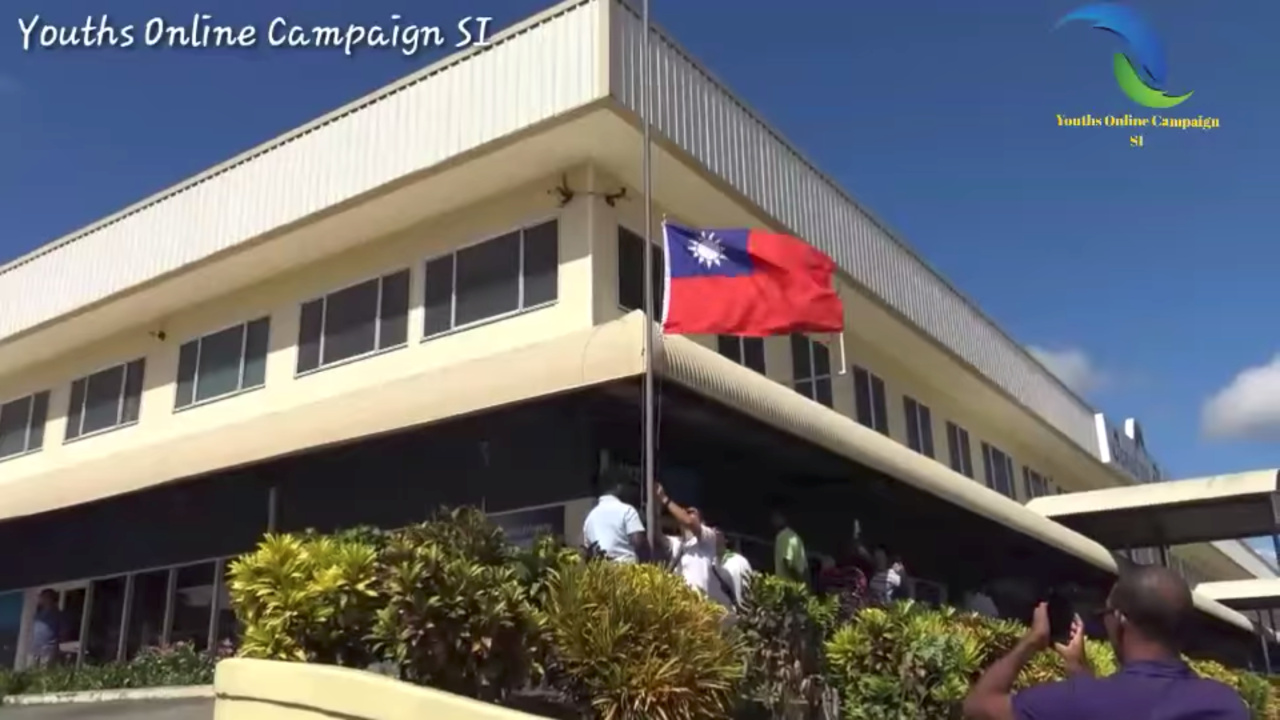 The Republic of China flag is lowered at the Taiwan embassy in Honiara, Solomon Islands September 17, 2019 in this still image taken from social media video. (AFP)