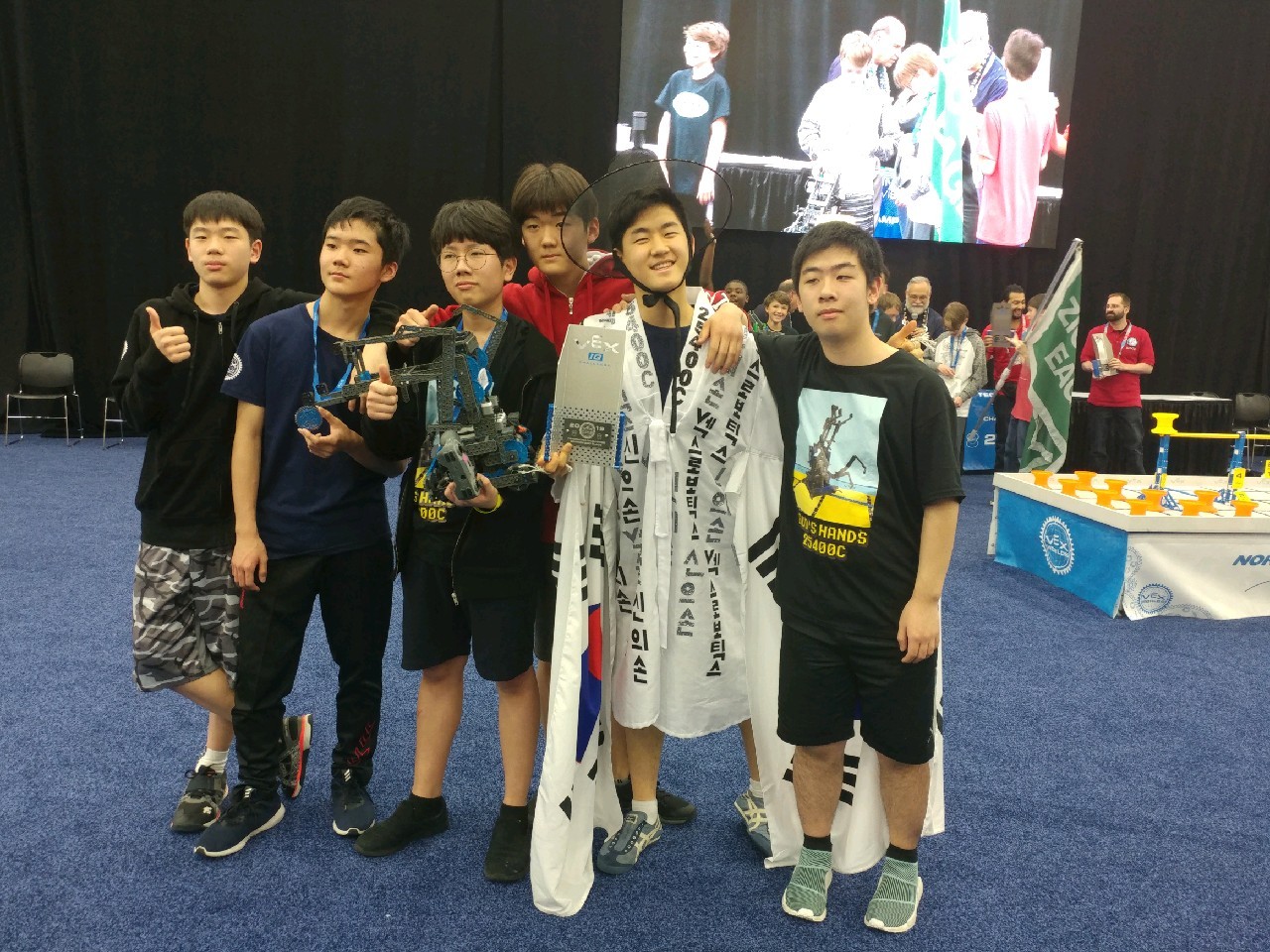Dwight School Seoul robotics team members pose for pictures at the Vex Robotics World Championship in Kentucky, on May 1. (Dwight School Seoul)