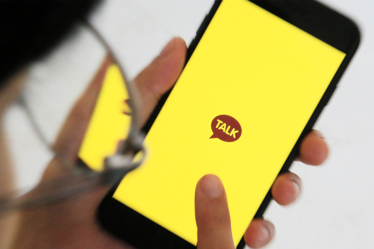 A smartphone user uses the KakaoTalk chatting app. Kakao