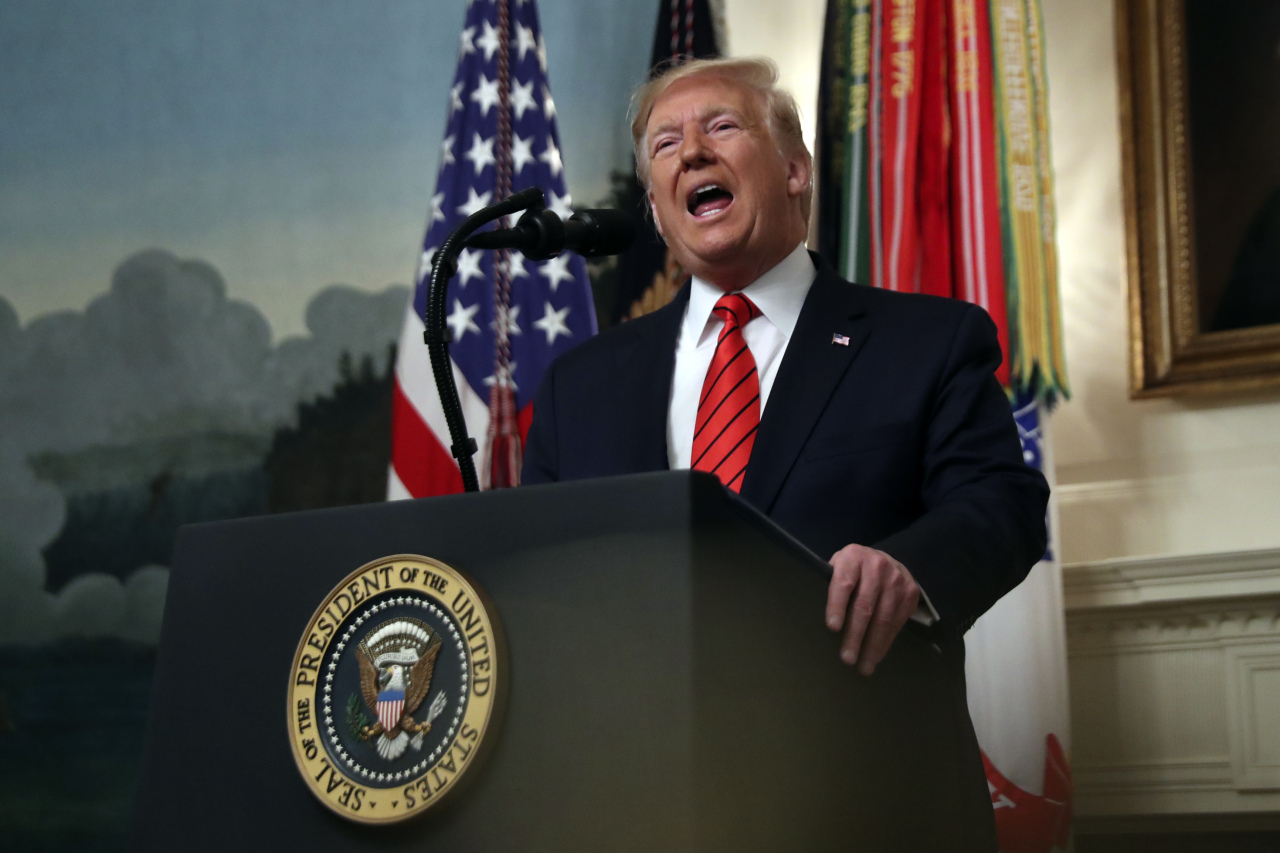 President Donald Trump speaks in the Diplomatic Room of the White House in Washington, Sunday. (AP)
