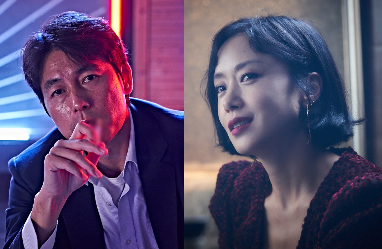 Jung Woo-sung (left), playing Tae-young, and Jeon Do-yeon, playing Yeon-hee, in the movie "Beasts Clawing at Straws." (Megabox Joongang Plus M)