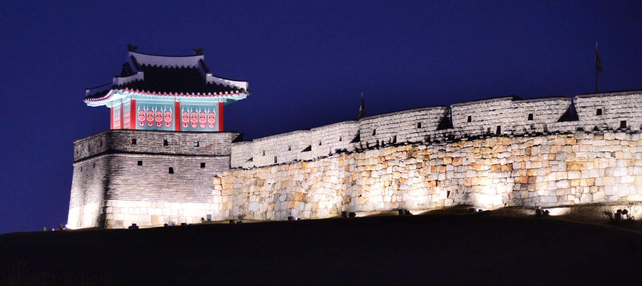 Suwon Hwaseong Fortress UNESCO World Heritage Site walls and watchtower at sunset showing the late 18th century Joseon dynasty fortress built by King Jeongjo in Suwon Korea