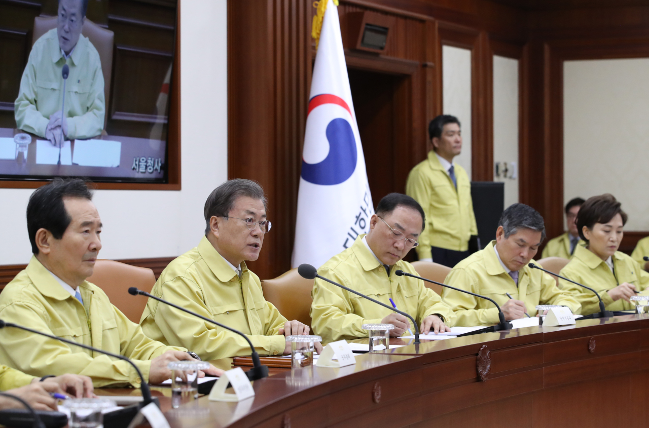 President Moon Jae-in speaks at the coronavirus response meeting at the government complex in Seoul on Thursday. Yonhap