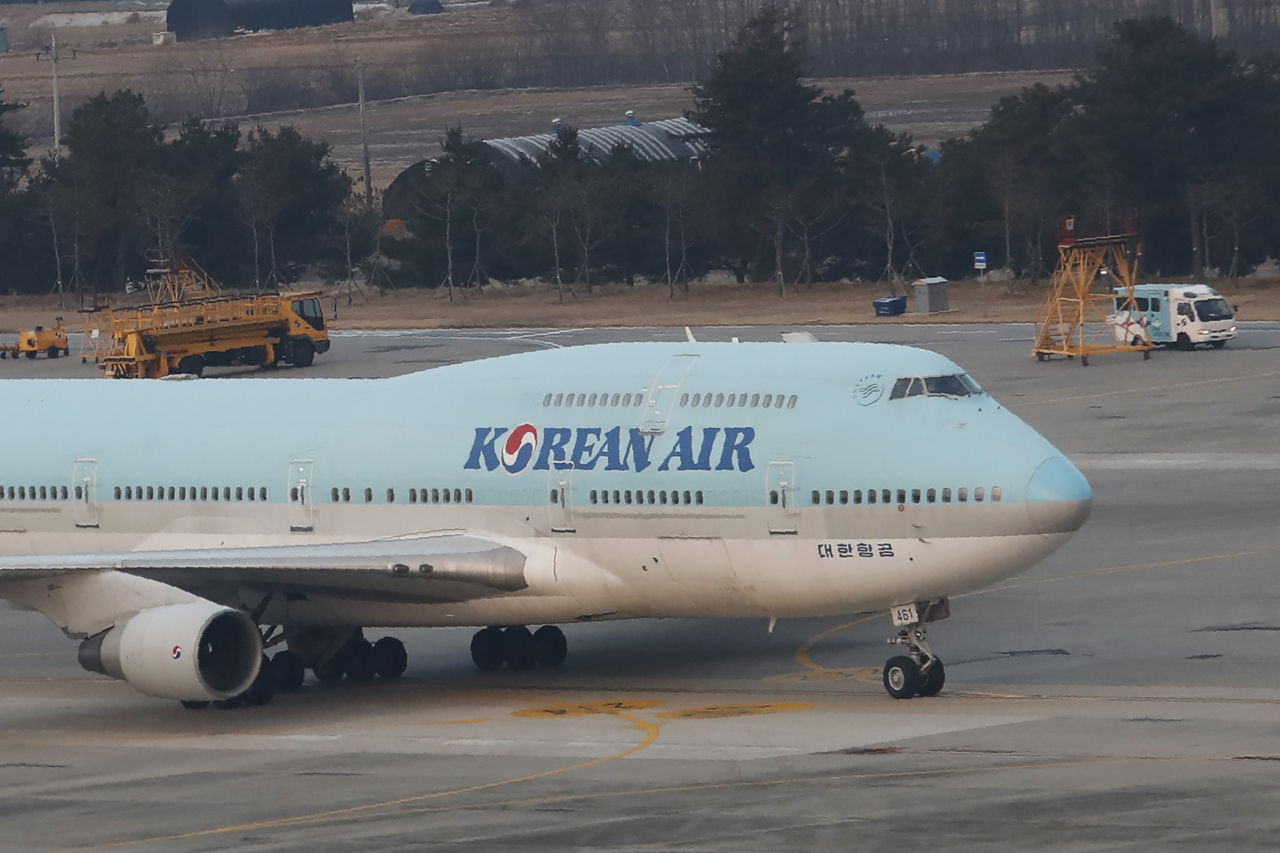 A South Korean chartered plane carrying evacuees from Wuhan, China, taxis after landing at Gimpo International Airport on Friday. Yonhap