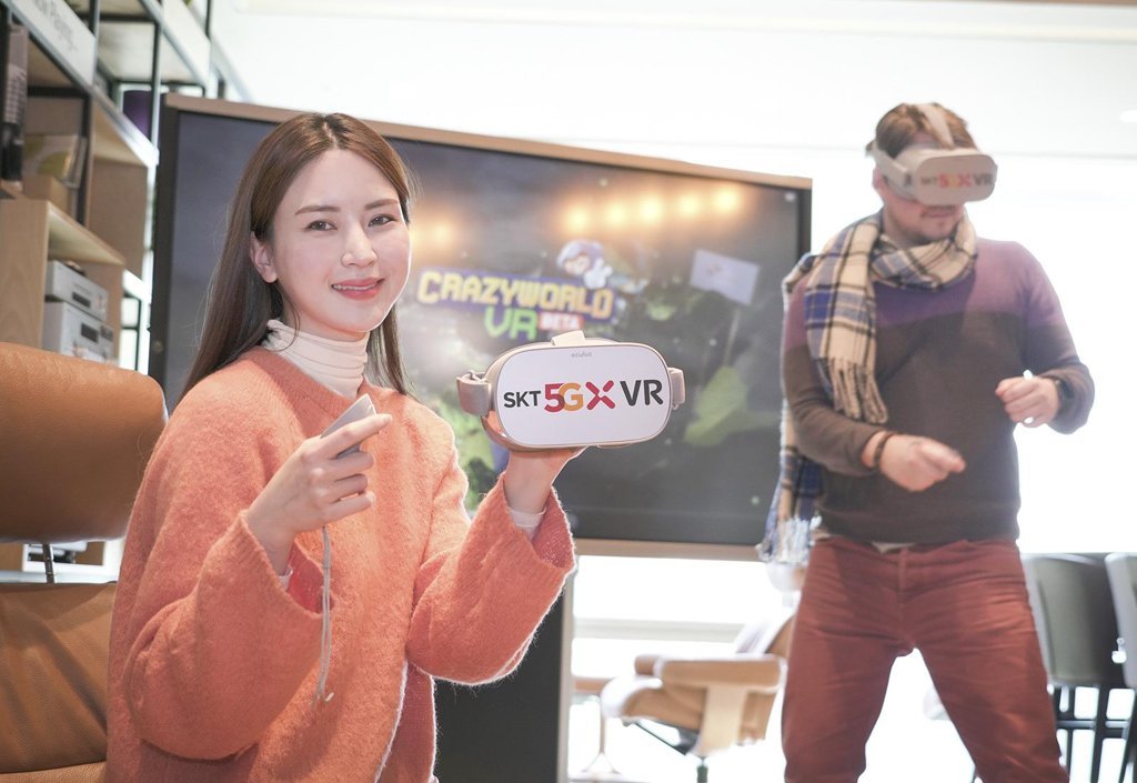 Models present the virtual reality game "Crazy World VR" (SK Telecom Co.)
