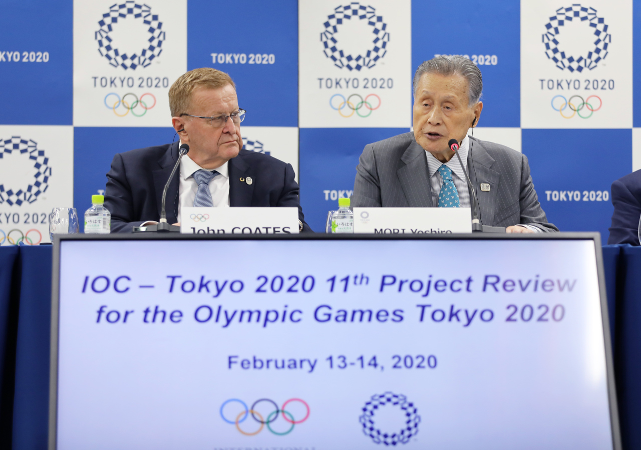 John Coates (left), chairman of International Olympic Committee (IOC) Coordination Commission for the Olympic Games Tokyo 2020, and Mori Yoshiro, president of Tokyo Organising Committee of the Olympic and Paralympic Games (Tokyo 2020), attend the IOC-Tokyo 2020 joint press conference for the 11th Project Review meeting between the IOC and Tokyo 2020 in Tokyo on Friday.(Xinhua-Yonhap)