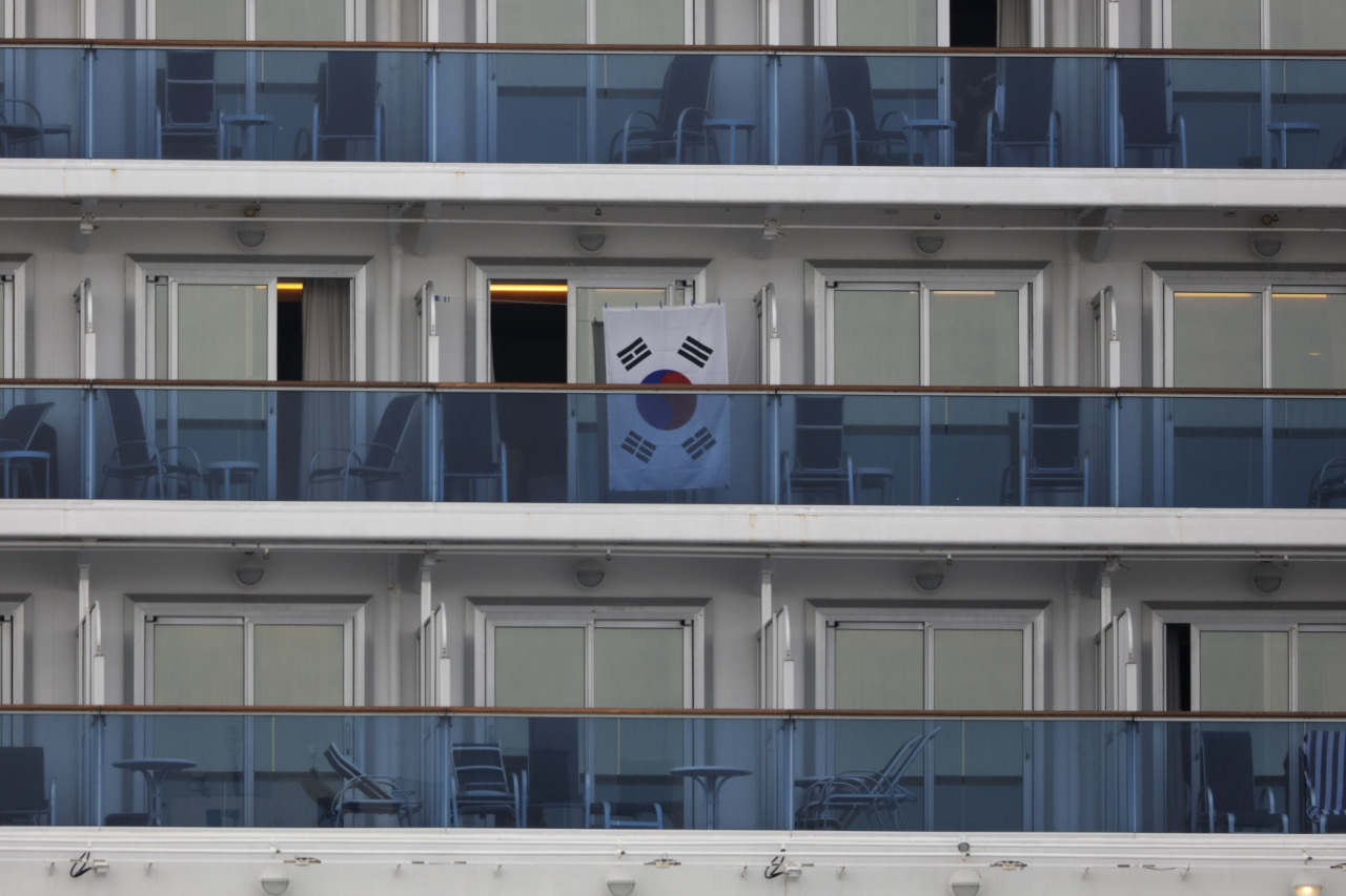 A South Korean flag hangs outside a cabin of the quarantined Diamond Princess cruise ship at the Yokohama port in Japan. (AP-Yonhap)