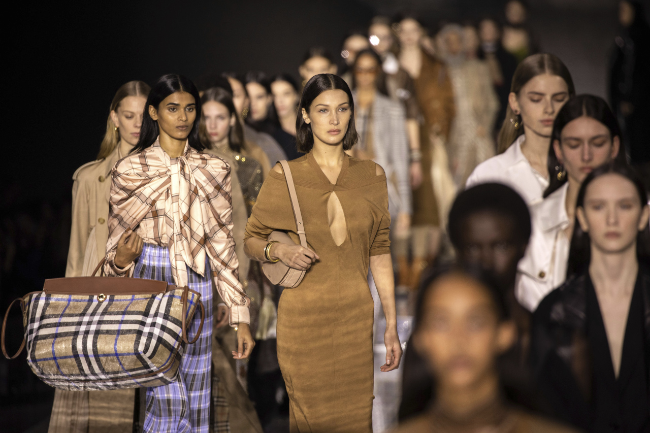Model Bella Hadid, centre, and other models wear creations by designer Burberry at the Autumn/Winter 2020 fashion week runway show in London, Monday. (AP-Yonhap)