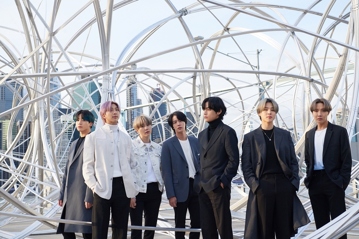 BTS next to "New York Clearing" by Antony Gormley" at Brooklyn Bridge Park Pier3, New York City, an art installment as part of "CONNECT, BTS." (Big Hit Entertainment)