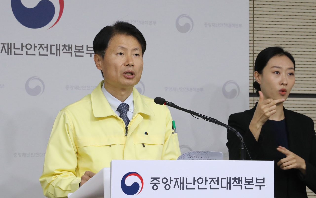 Vice Minister of Health and Welfare Kim Gang-lip briefs the media on Friday. Yonhap