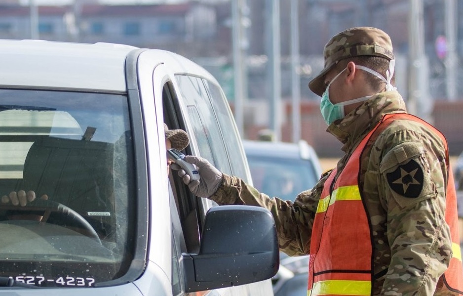 (ATTN: RECASTS headline, lead; UPDATES throughout with more info, latest figure)
SEOUL, March 6 (Yonhap) -- A South Korean employee of U.S. Forces Korea (USFK) has tested positive for the new coronavirus, bringing the total number of USFK-related infection cases to seven, the military said Friday.
The seventh patient marks the first coronavirus case reported at Camp Humphreys in Pyeongtaek, south of Seoul, where the USFK headquarters is located.
She is now in isolation at her off-base residence in the central city of Cheonan, according to USFK.
She visited a cafe and a post exchange in the base on Feb. 26 and took leave until she came back to work on Thursday.
"The individual took the test yesterday, the results came back this morning," Garrison Commander Col. Michael Tremblay told a Facebook live briefing. "We back-traced everywhere she has been."
All the people who had direct contact with the patient are now in self-quarantine, he added.
USFK remains on "high" risk level peninsula-wide and is implementing all appropriate control measures to help mitigate the spread of the virus to protect the force, it added.
As of Friday, South Korea had reported 6,593 virus patients, including 42 deaths.
A military guard at U.S. Army Garrison Humphreys in Pyeongtaek, 70 kilometers south of Seoul, checks the temperature of a driver to screen entrants to the compound for the novel coronavirus on Feb. 28, 2020, in the photo provided by United States Forces Korea. (PHOTO NOT FOR SALE) (Yonhap)