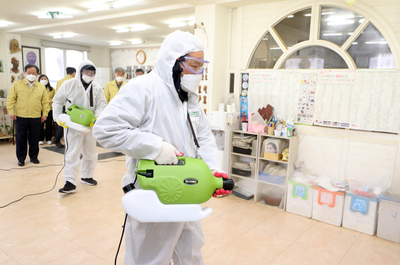 Busan Office of Education on Friday dispatched a team of officials to disinfect a cram school in the city's northern district of Dongnae. (Yonhap)