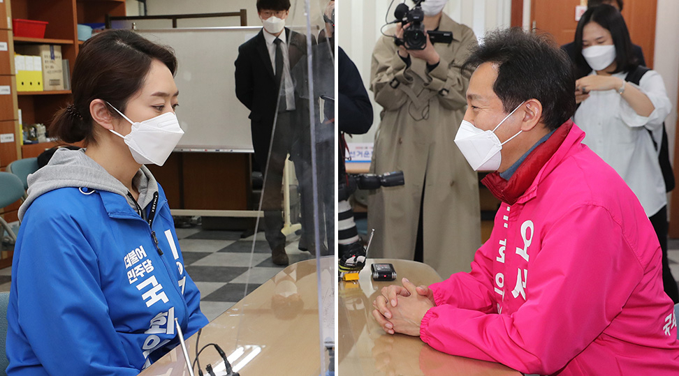 서울 광진을에 출마하는 더불어민주당 고민정 후보(사진 왼쪽)와 미래통합당 오세훈 후보가 26일 오전 서울 광진구 선거관리위원회에서 후보자 등록을 하고 있다. [연합]