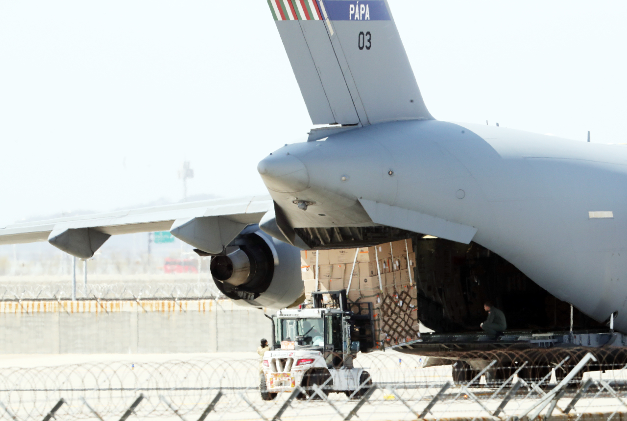 Romania sent NATO aircraft on Friday to carry test kits and hazmat suits from Korea.  (Yonhap)