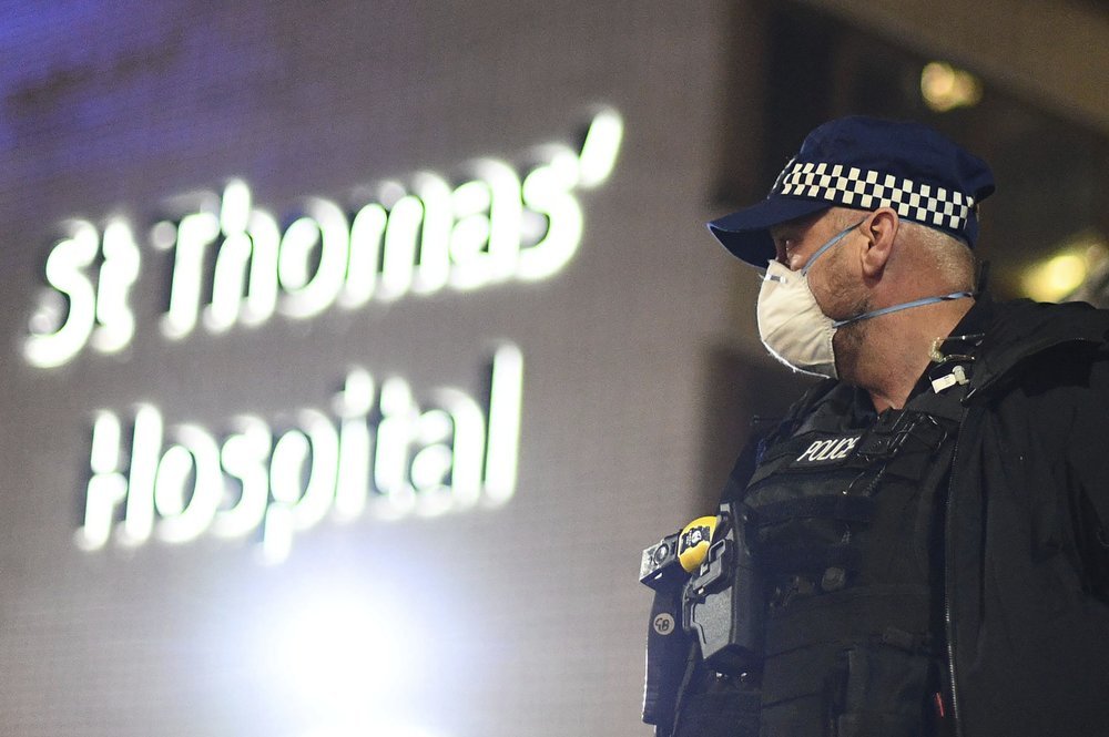 A police officer stands outside St Thomas' Hospital in central London as British Prime Minister Boris Johnson was moved to intensive care after his coronavirus symptoms worsened on Monday April 6, 2020. Johnson was admitted to St Thomas' hospital in central London on Sunday after his coronavirus symptoms persisted for 10 days. Having been in hospital for tests and observation, his doctors advised that he be admitted to intensive care on Monday evening. (AP)