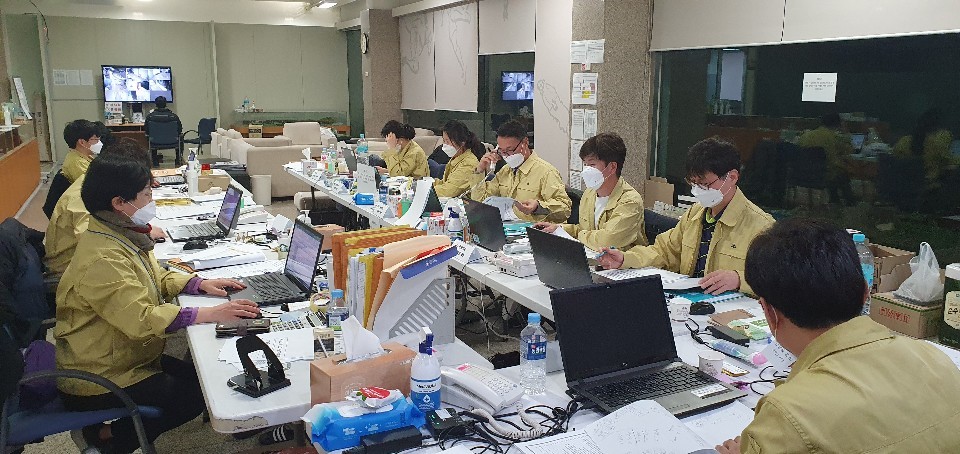 Health officials dispatched to the treatment center work in the situation room. (courtesy of staffer)