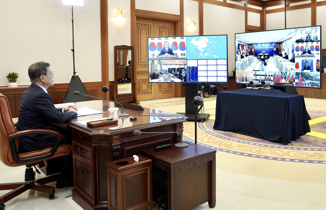 President Moon Jae-in participates in the ASEAN+3 teleconference on Tuesday. Yonhap