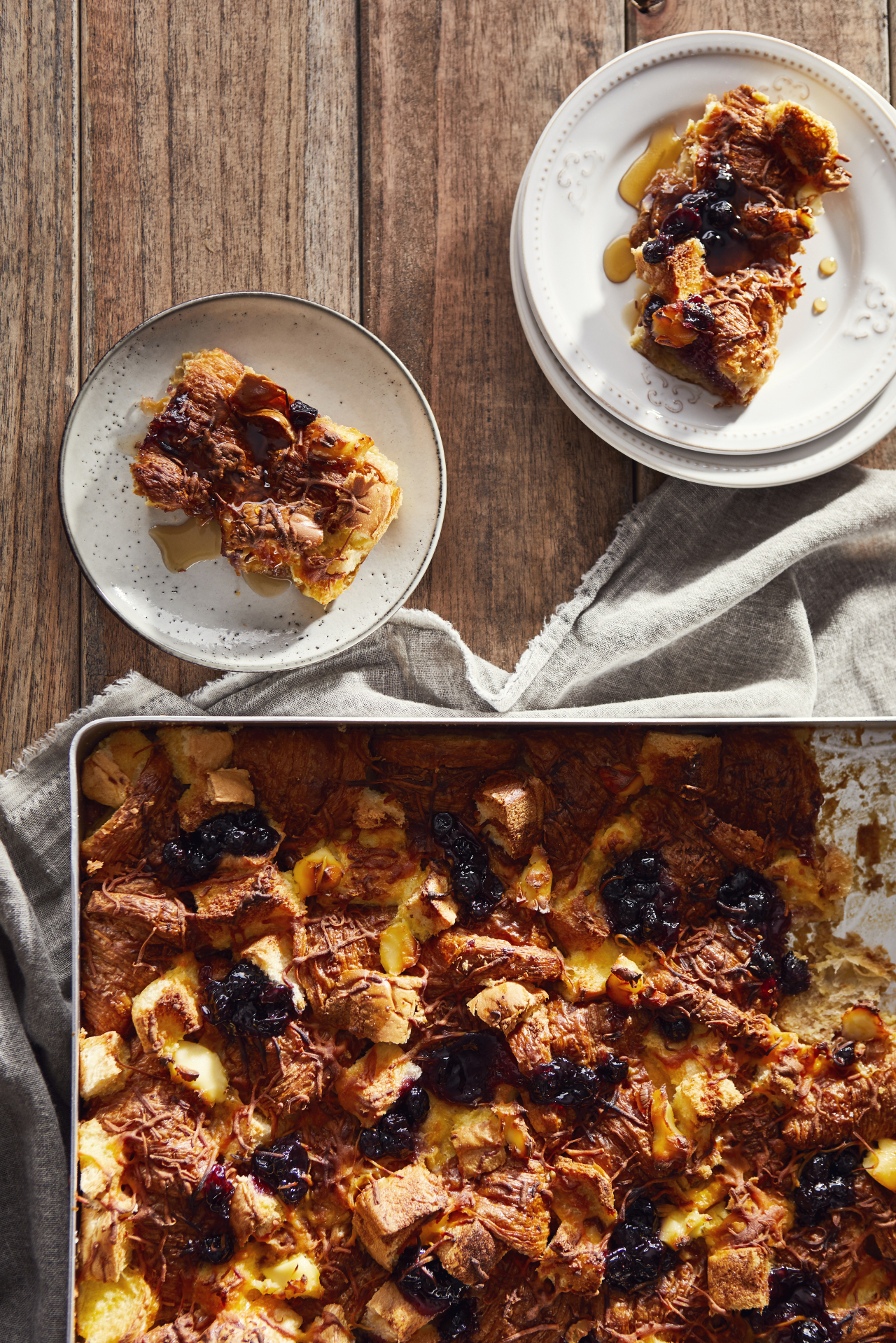 Croissant strata brunch bread pudding from Bimbom Sim Ka young cookbook Brunch Time featuring croissants soaked in eggs milk cream maple syrup vanilla topped with blueberry jam cream cheese butter baked into golden crispy edges moist center Seoul brunch casserole from Gyeongnidan gil Itaewon and Seoul Forest Seongsu cafes