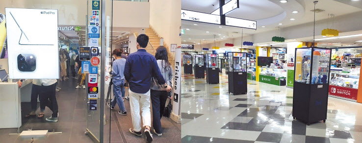 같은 주말 다른 분위기. 지난 16일 오후 8시께 방문한 서울 중구 애플 프리즈비 매장에는 사람들이 몰렸다(왼쪽) 반면 지난 17일 오후 2시께 방문한 서울 용산구 전자랜드에는 손님을 드문드문 찾아볼 수 있을 정도로 한산했다. 김빛나 기자