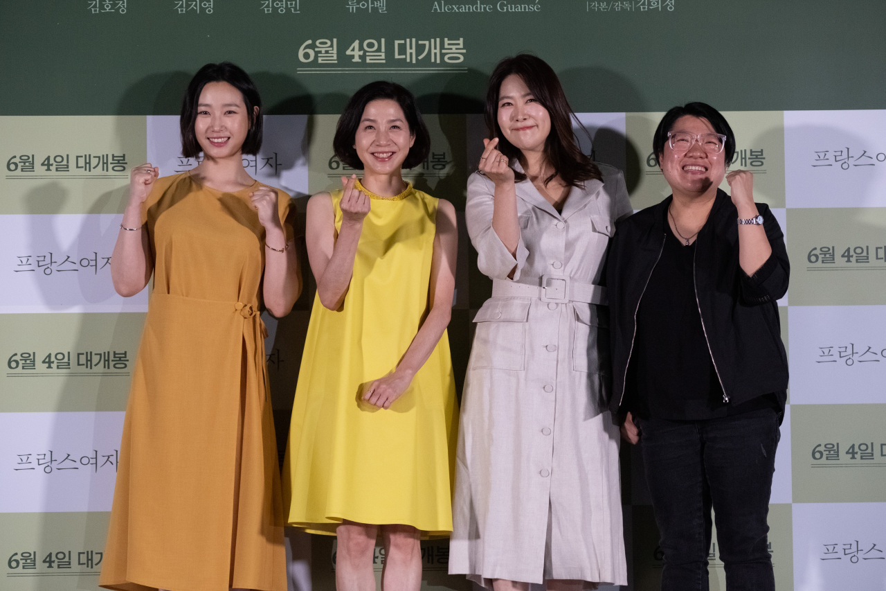 Actors Ryu A-bel (from left), Kim Ho-jeong and Kim Ji-young and director Kim Hee-jung pose for pictures at the film’s press conference held in Seoul on Monday. (Lotte Entertainment)