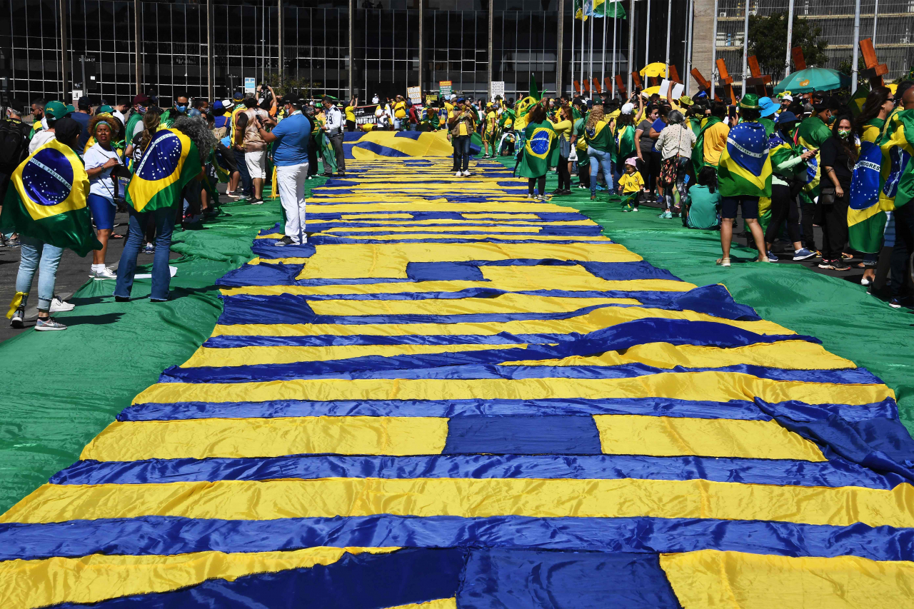 Evangelical groups take part in a demonstration in support of Brazilian President Jair Bolsonaro's government in front of the Congress in Brasilia, on July 19, 2020. (Photo by EVARISTO SA / AFP)