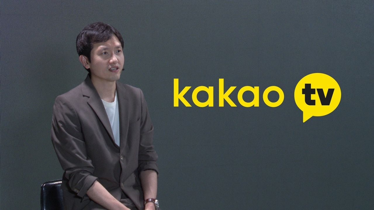 Shin Jong-su, director of Kakao M’s digital media content department, speaks in a prerecorded video released Tuesday. (Kakao M)