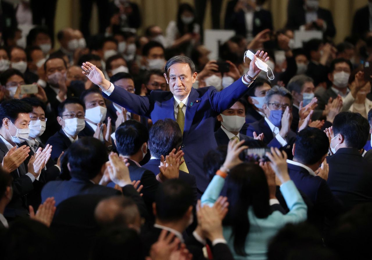 Japan's Chief Cabinet Secretary Yoshihide Suga reacts after he was elected as new head of Japan's ruling Liberal Democratic Party at the party's leadership election in Tokyo on Monday. (AFP-Yonhap)
