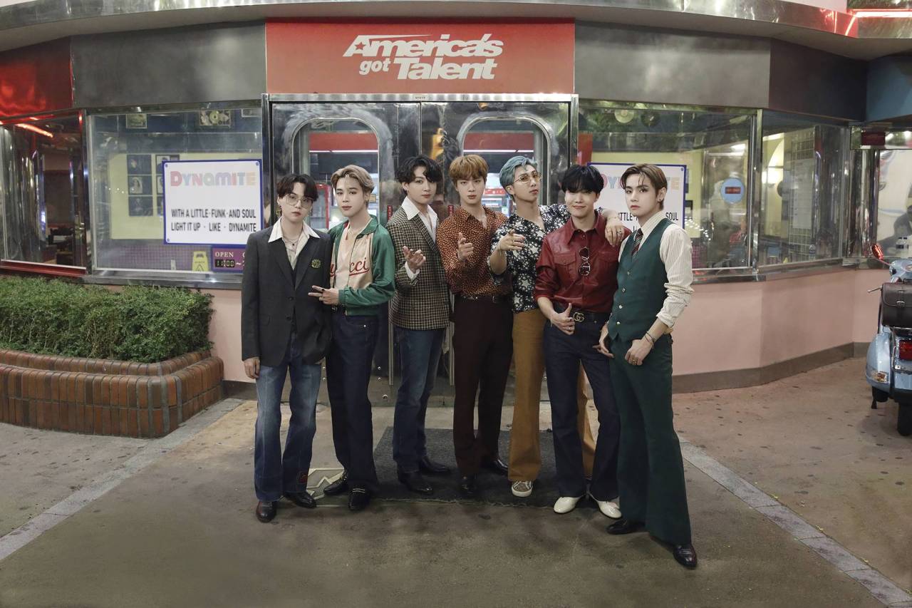 BTS members dressed in black hanbok perform IDOL in front of Geunjeongjeon Hall at Gyeongbokgung Palace for The Tonight Show Starring Jimmy Fallon in 2020