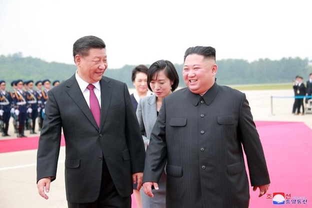 Chinese President Xi Jinping and North Korean leader Kim Jong-un (KCNA)
