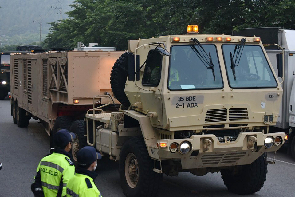 Military vehicles transport missiles to the site of the THAAD base in the town of Seongju, North Gyeongsang Province in May. (Yonhap)