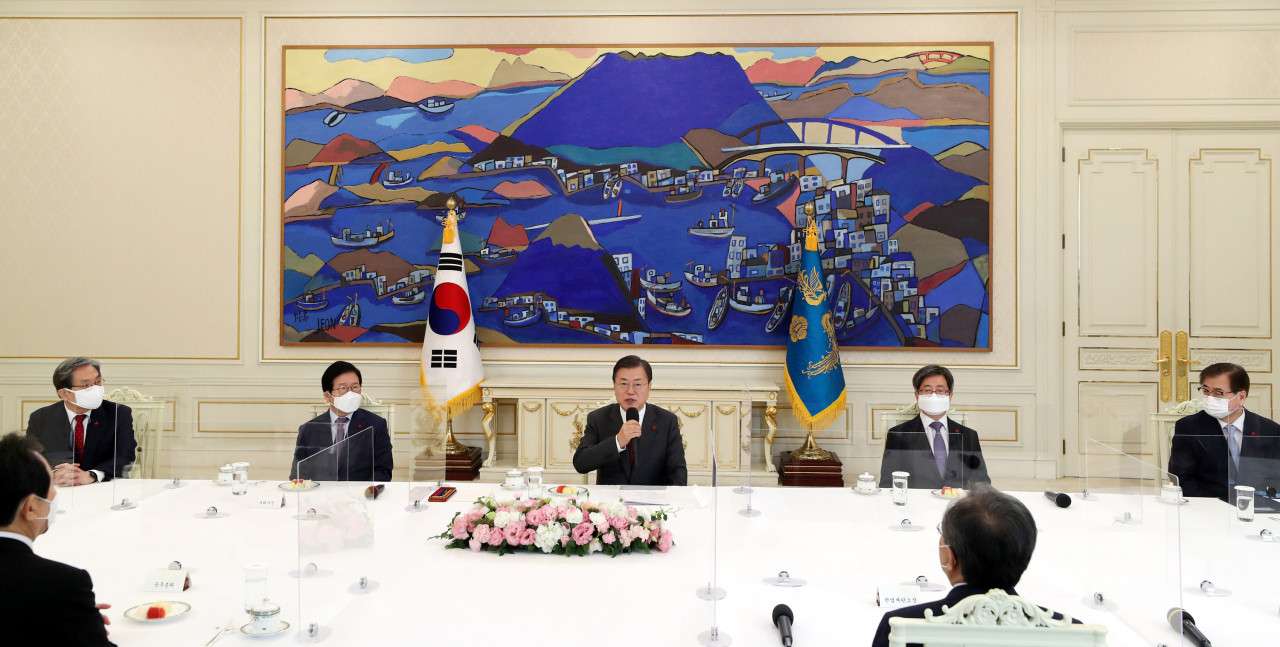 President Moon Jae-in (center) speaks Tuesday during a meeting with the five highest national leaders at the Blue House in Seoul. (Yonhap)