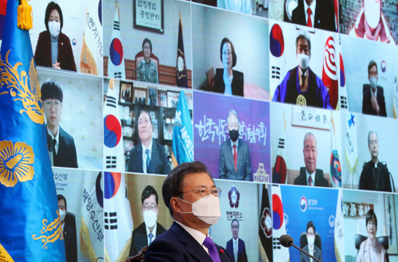 President Moon Jae-in speaks during a virtual meeting with 50 representatives from political and business communities as well as members of the public at Cheong Wa Dae in Seoul on Thursday. (Yonhap